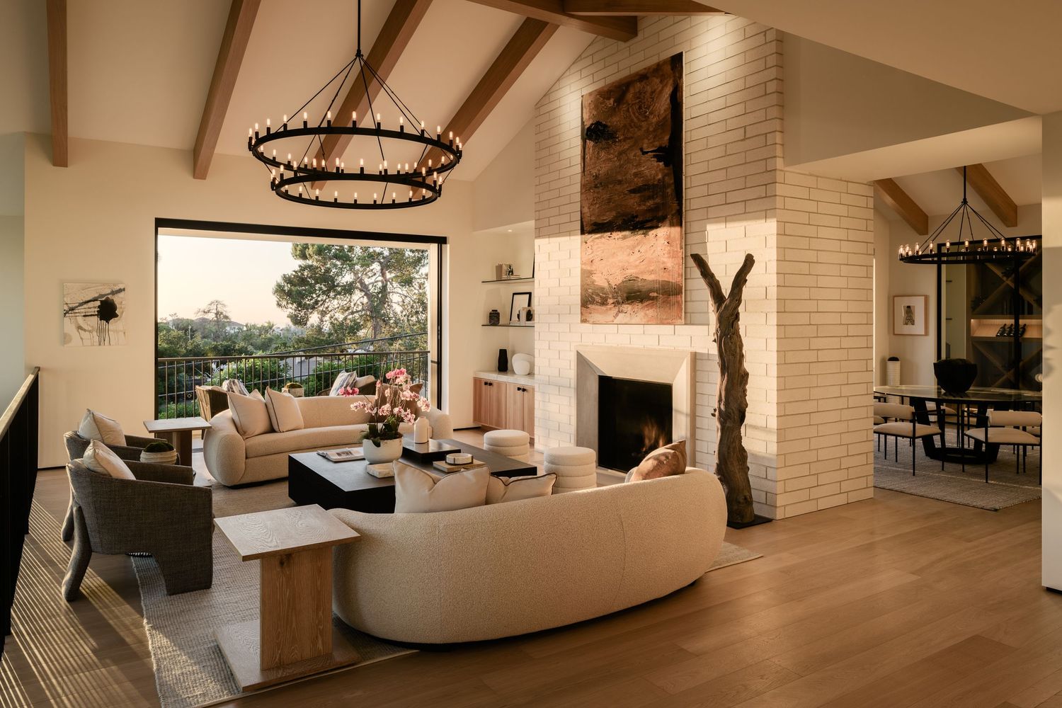 La Jolla 6357 Castejon luxury living room with vaulted beamed ceiling, chandelier, fireplace, and coastal design