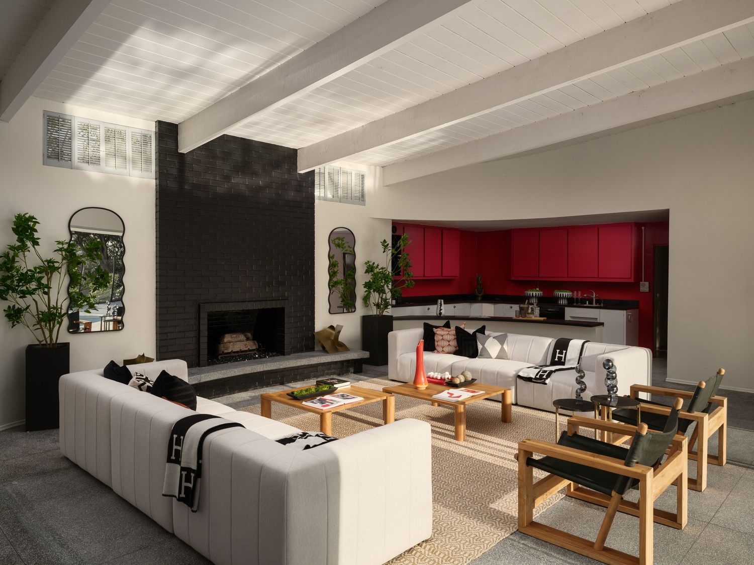 Midcentury modern living area at 1890 Spindrift Drive featuring clean architectural lines, custom fireplace, and layered coastal interiors.