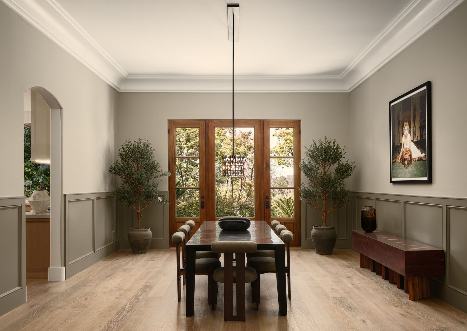 Elegant dining room in Rancho Santa Fe luxury flip, photographed with natural light, wainscoting, and warm refined styling.