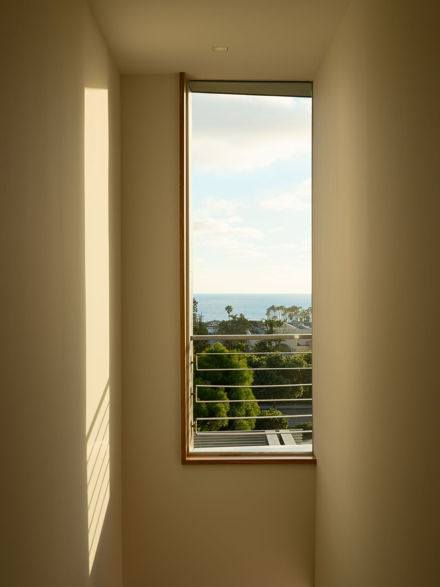 Minimal window detail at 7003 Fay Avenue capturing natural light, proportions, and the calm restraint of modern architecture.