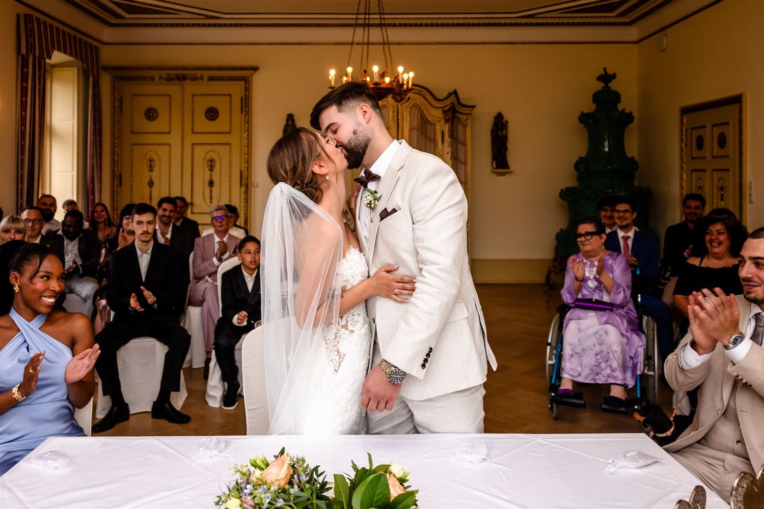 Collage of wedding celebration moments showing couples dancing and embracing at an elegant indoor reception venue.
