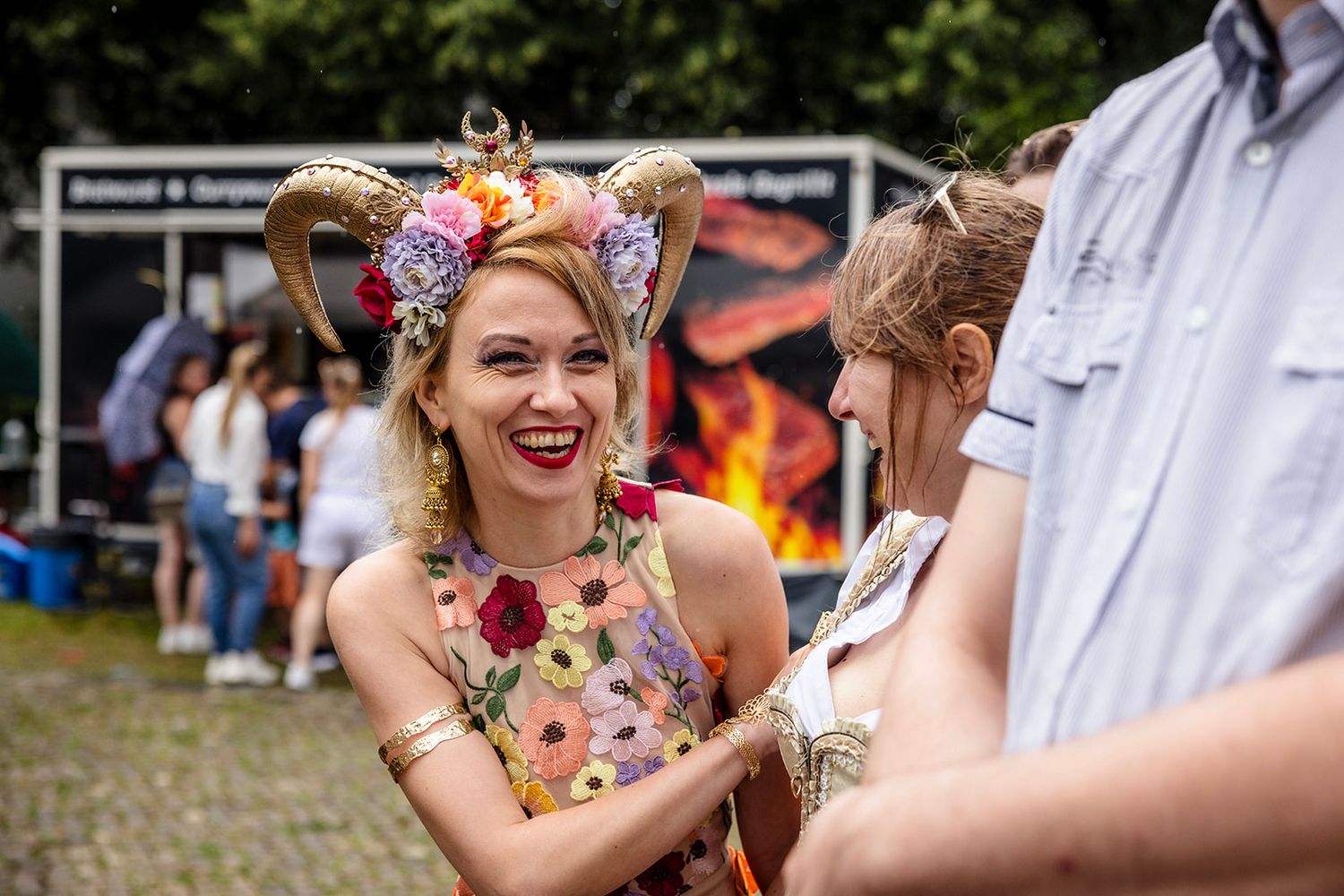 A series of candid moments at an outdoor wedding celebration showing guests enjoying themselves in a natural setting.