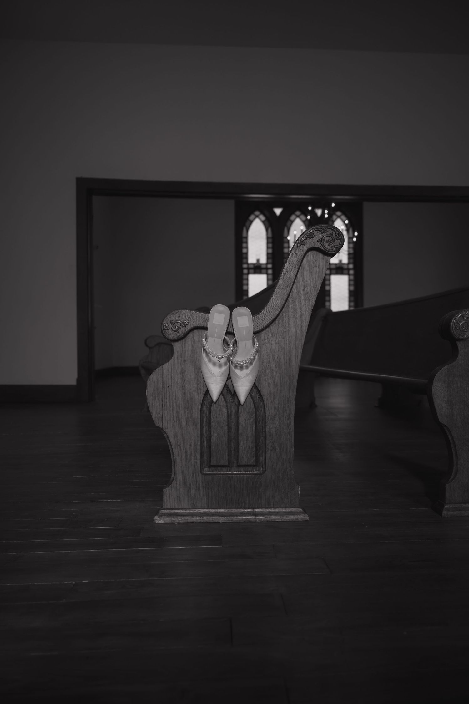 A sequence of dark, moody black and white images showing a silhouetted figure sitting in a chair against a window.