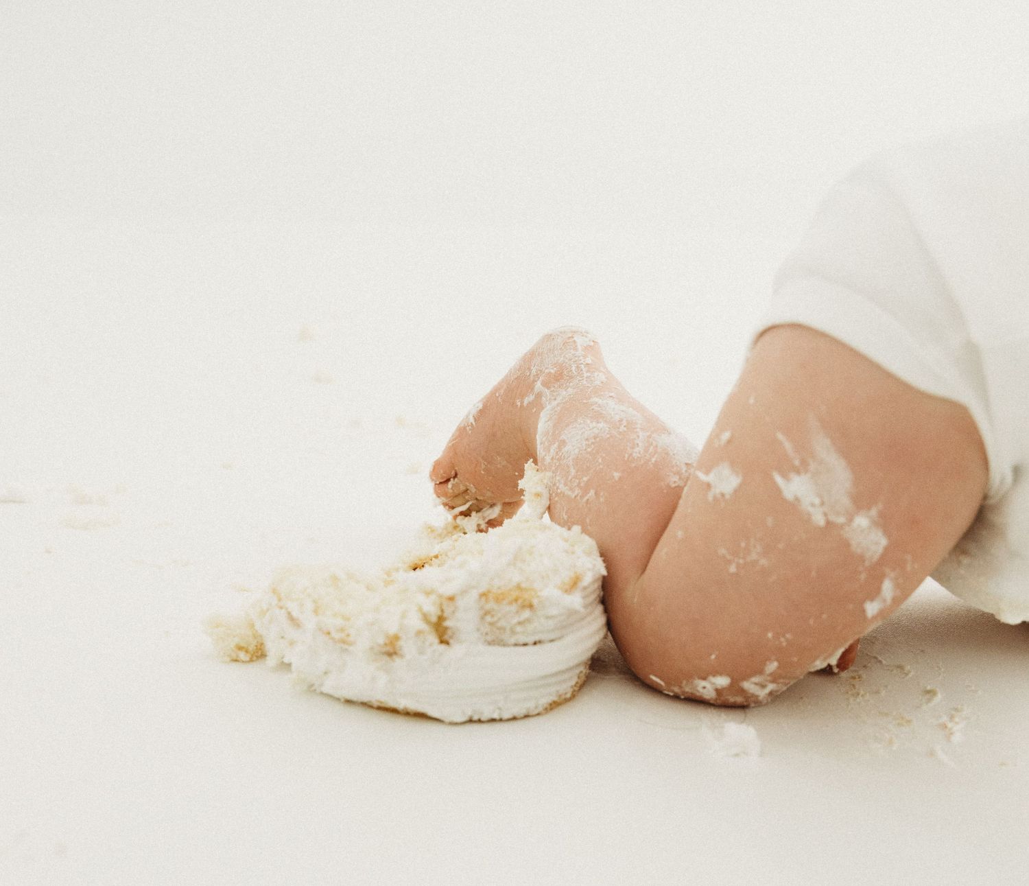 A sequence of broken eggshells in varying shades of brown and white arranged in a minimalist style on a light background.