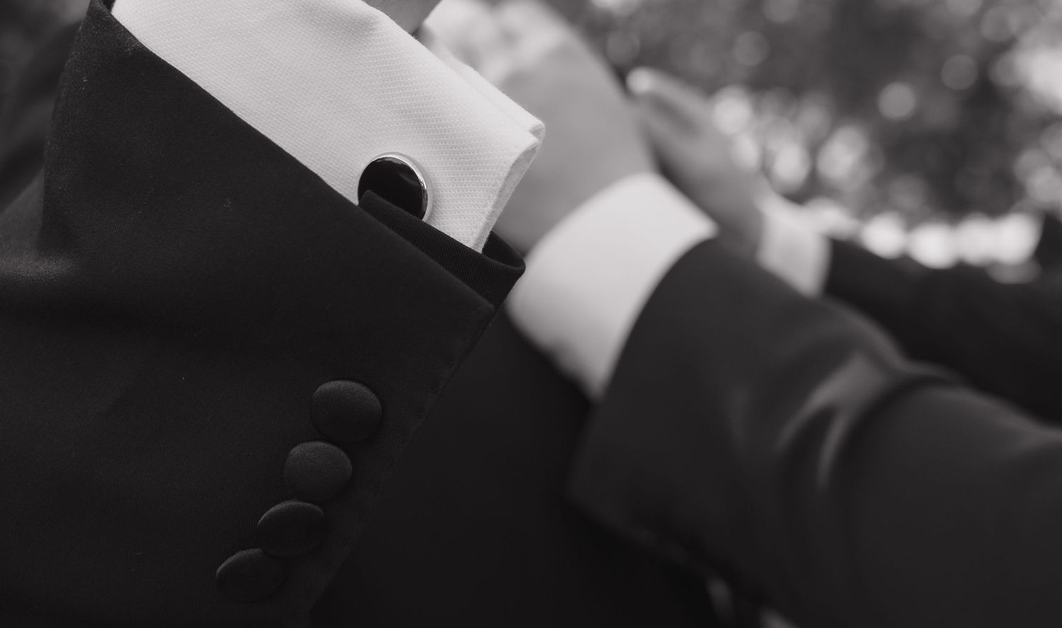 Close-up detail of formal attire at wedding ceremony.