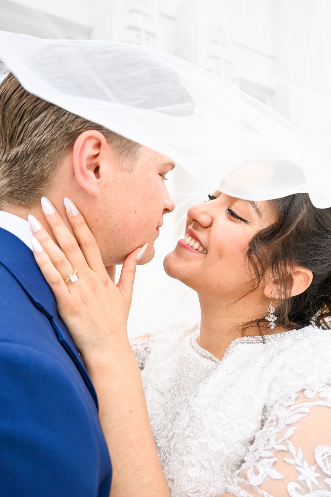 Romantic wedding couple sharing intimate kisses in sequence of four connected photos.