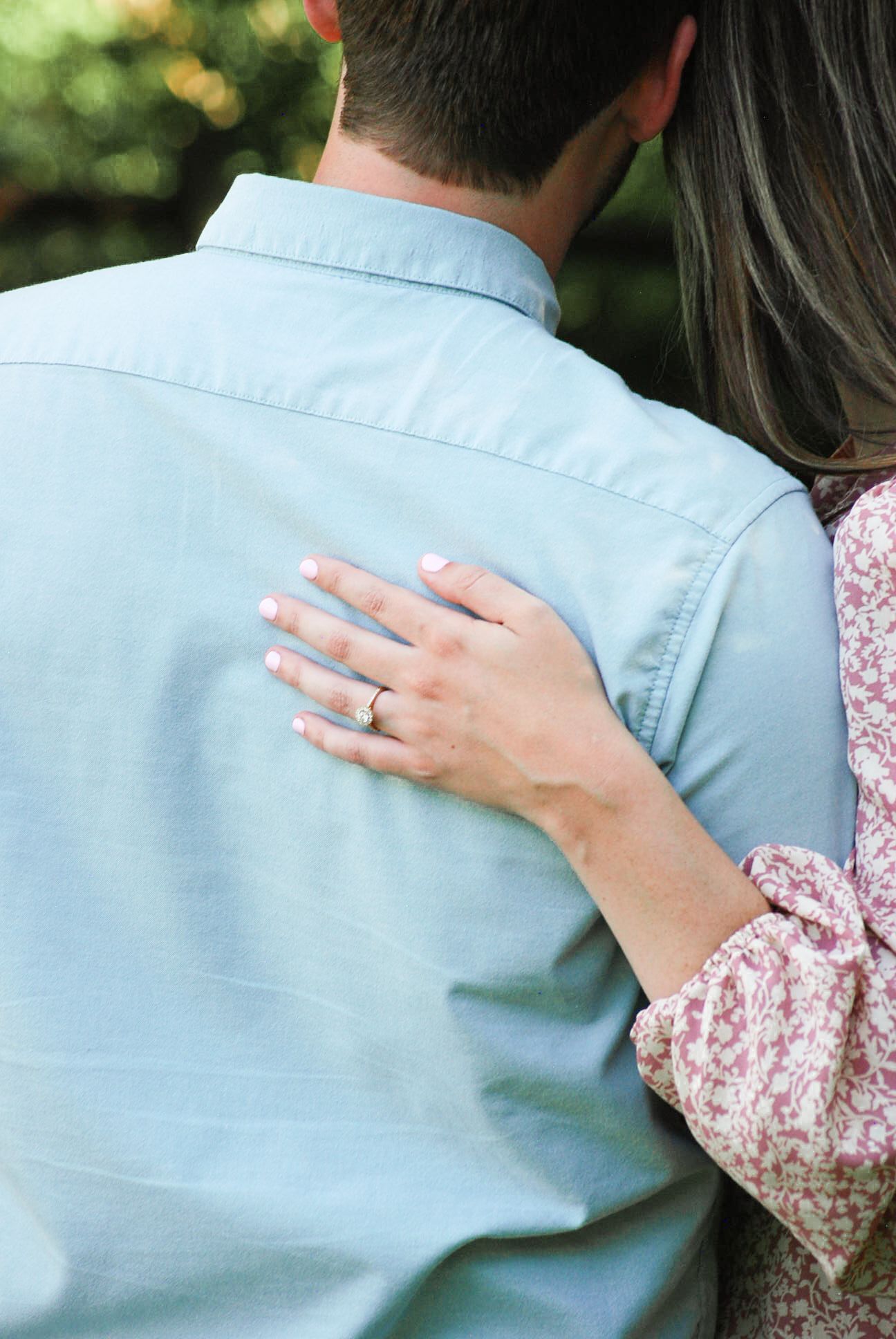 A series of photos showing hands embracing against a light blue shirt background.