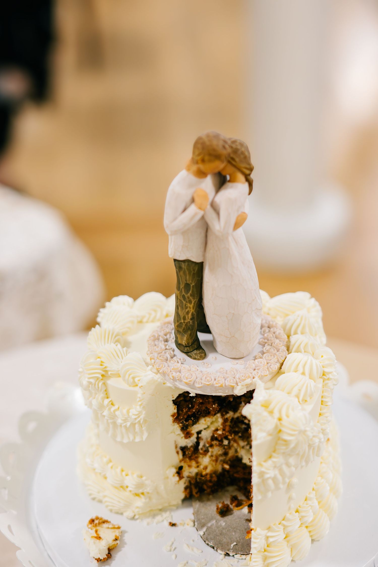 A series of wedding cake slices showing the interior layers and white frosting decoration against a light background.