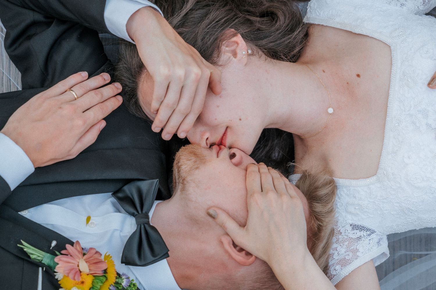 Close-up wedding portrait showing tender intimate moment between newlyweds.