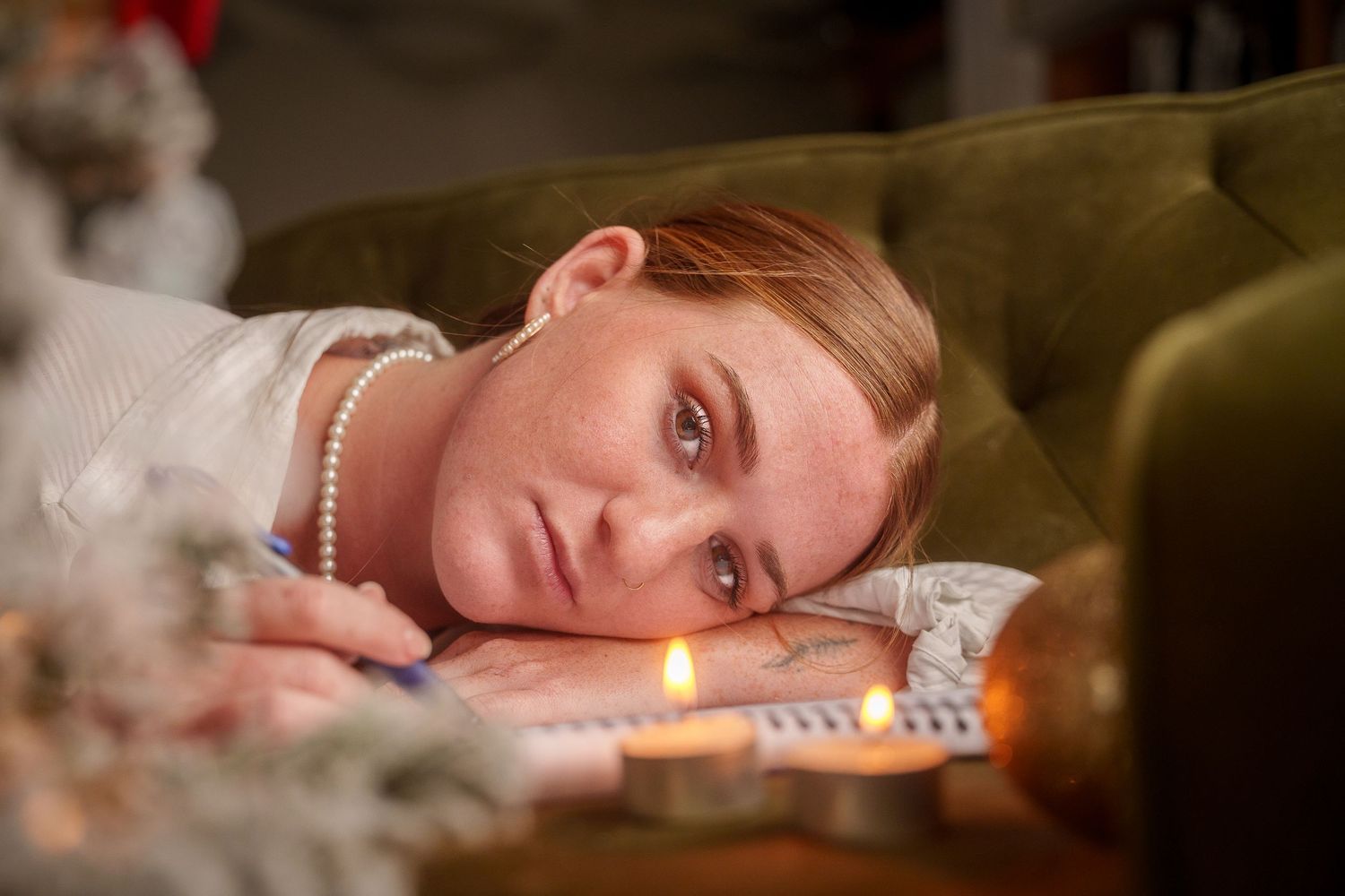 Intimate portrait series with soft lighting and candle glow.