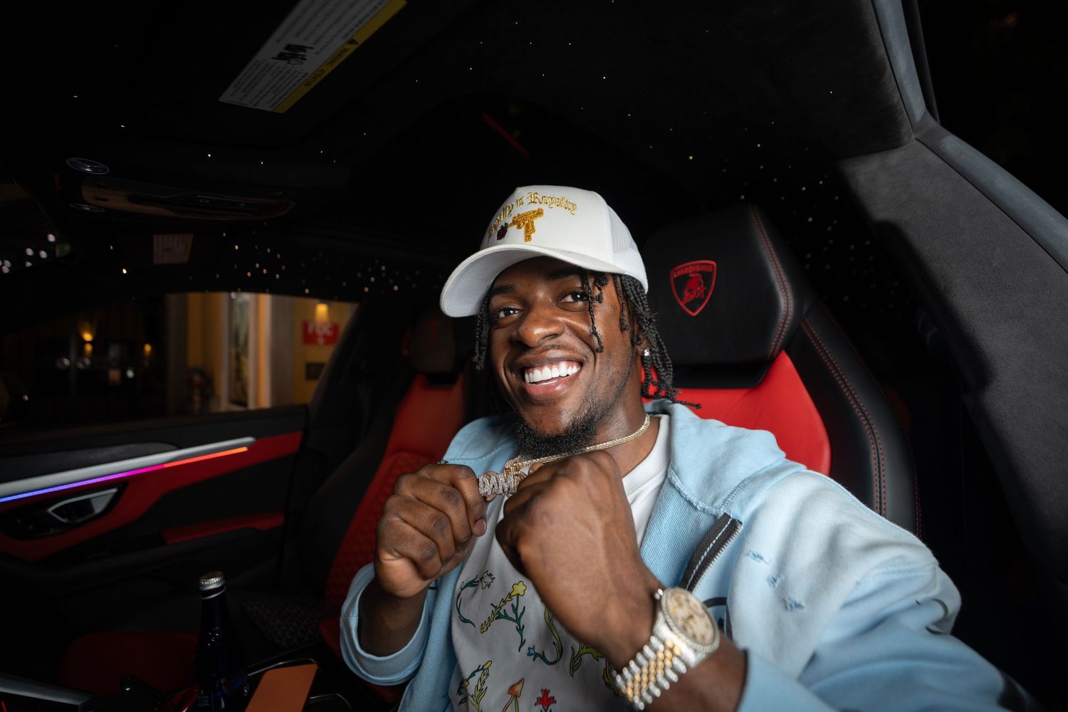 A collage of people smiling and laughing while seated in cars at night.