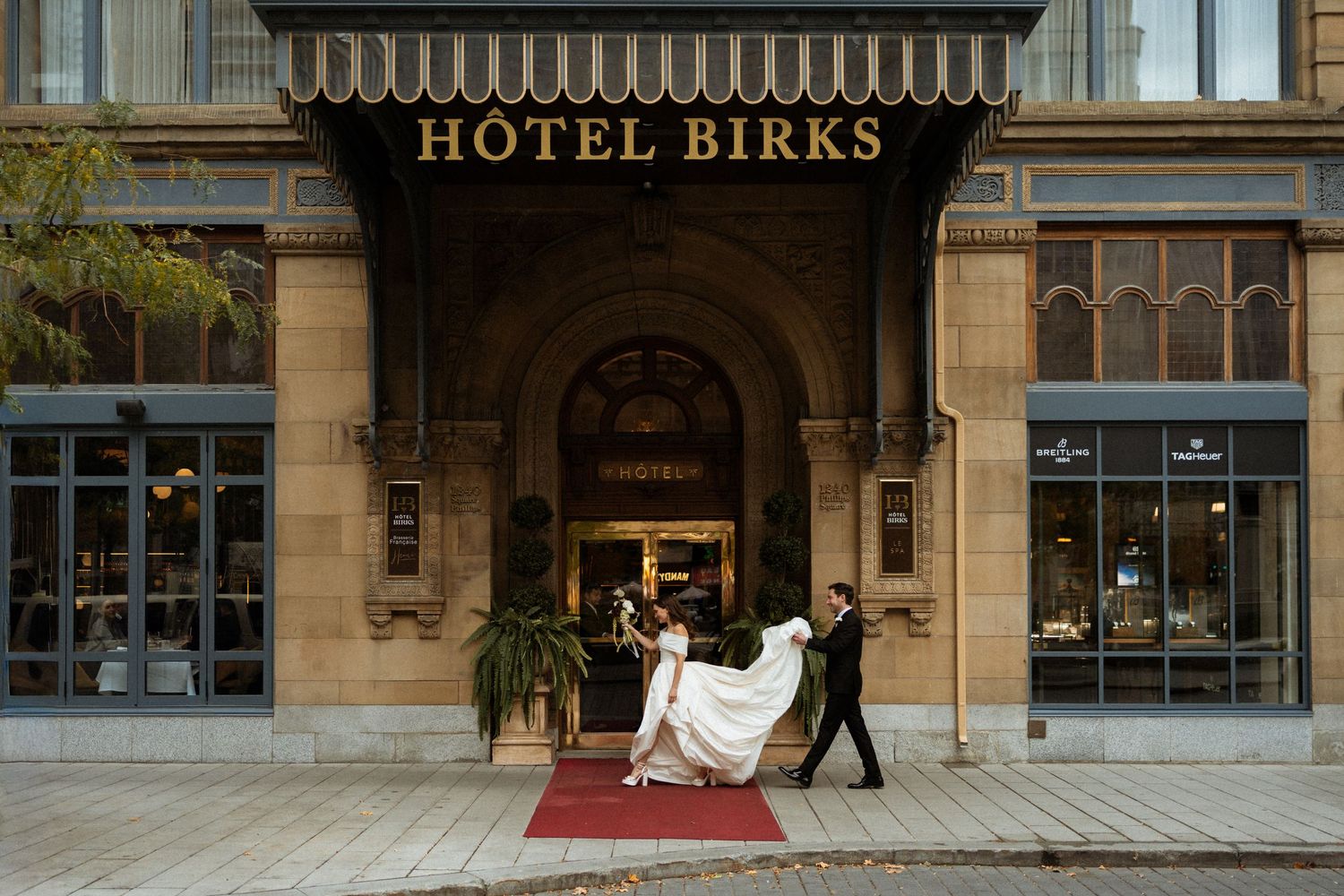Exterior view of Hotel Birks building with classic architecture and awnings.