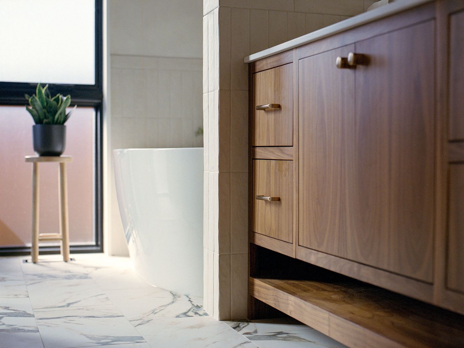 Modern kitchen cabinets with sleek hardware and clean lines in natural wood finish.