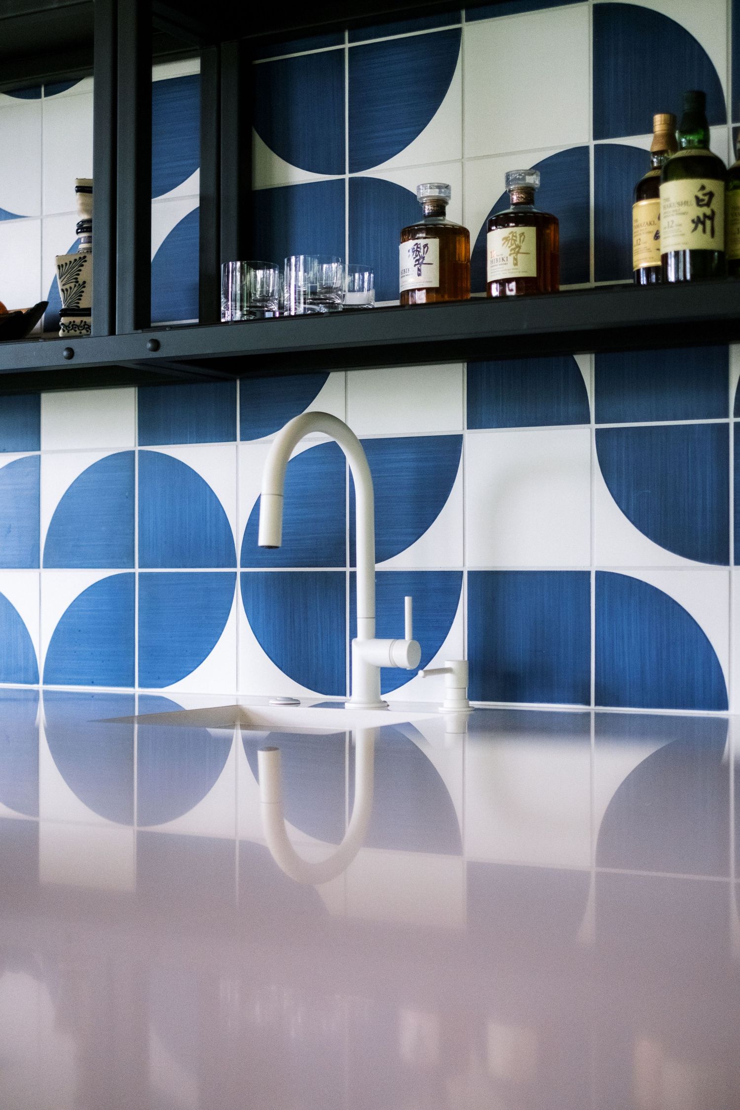 Blue and white geometric pattern design on office storage cabinets.