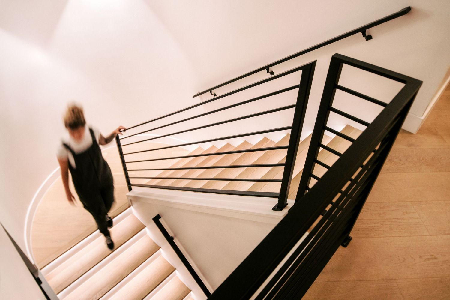 Black metal stair railing detail with modern geometric design.