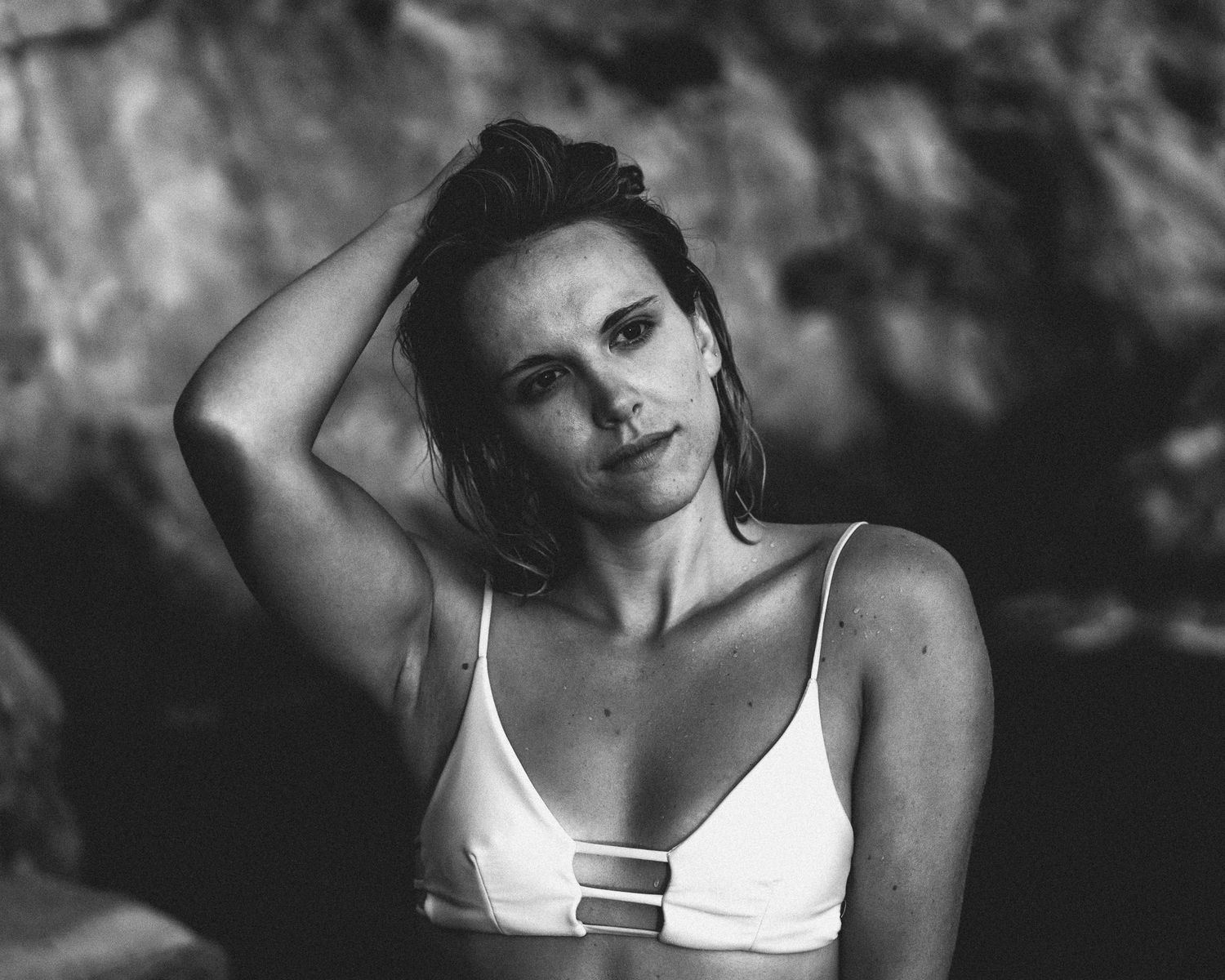 Black and white artistic portrait series showing emotional expressions and poses in dramatic lighting.