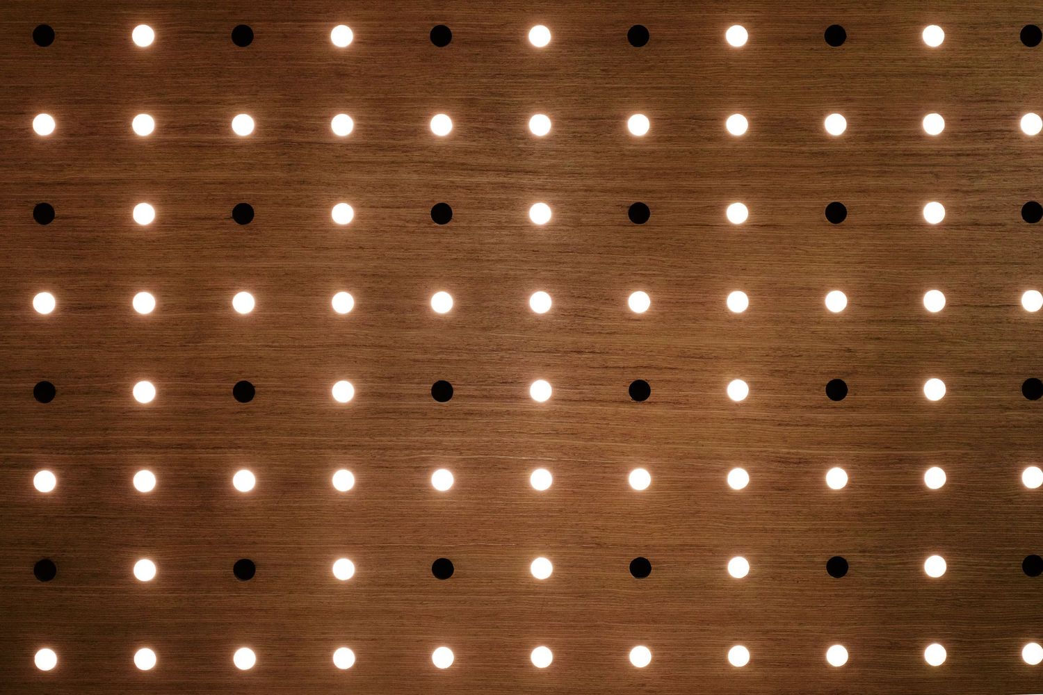 Wooden ceiling with rows of decorative string lights creating warm ambiance.