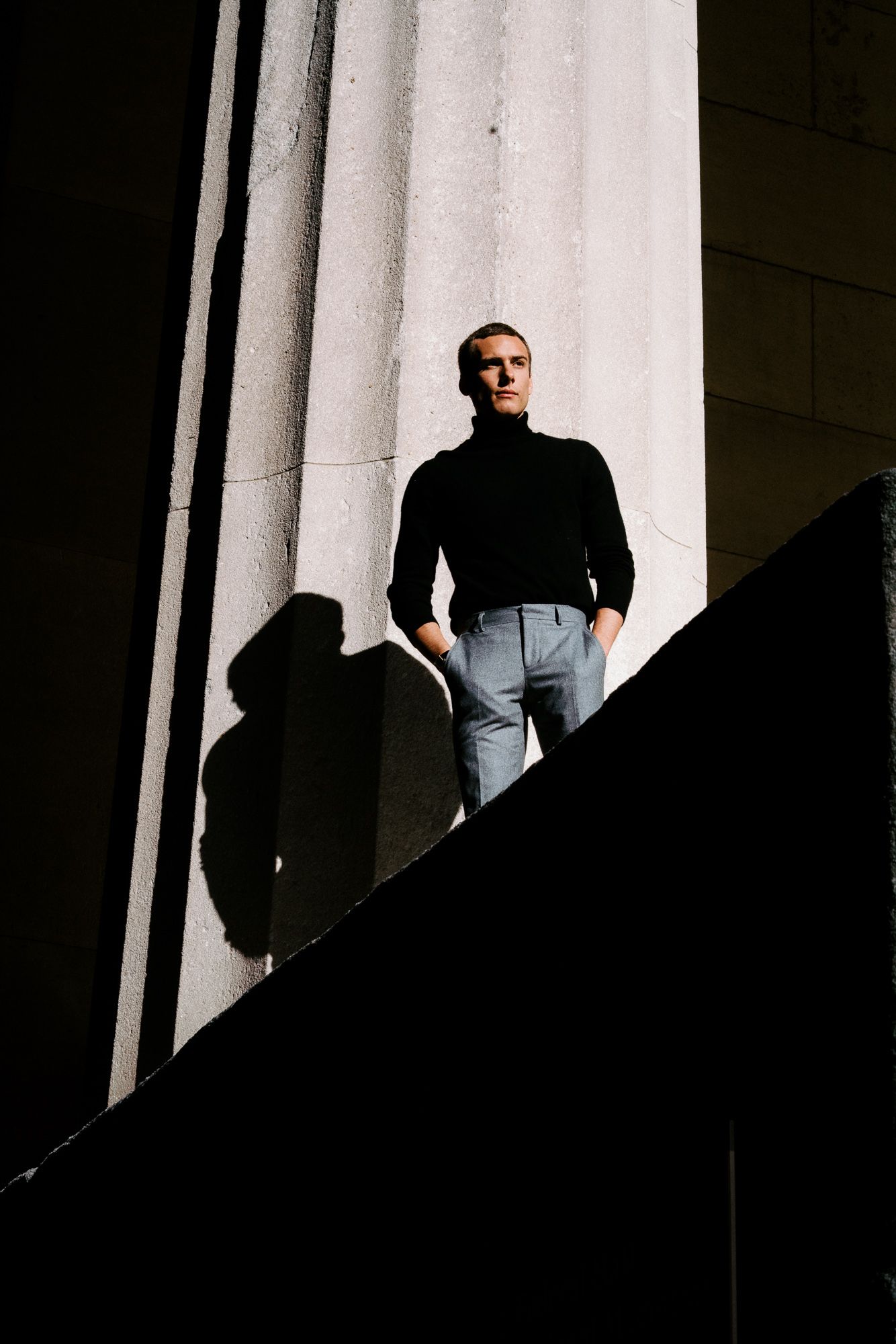 Dramatic contrast of light and shadow on architectural columns.