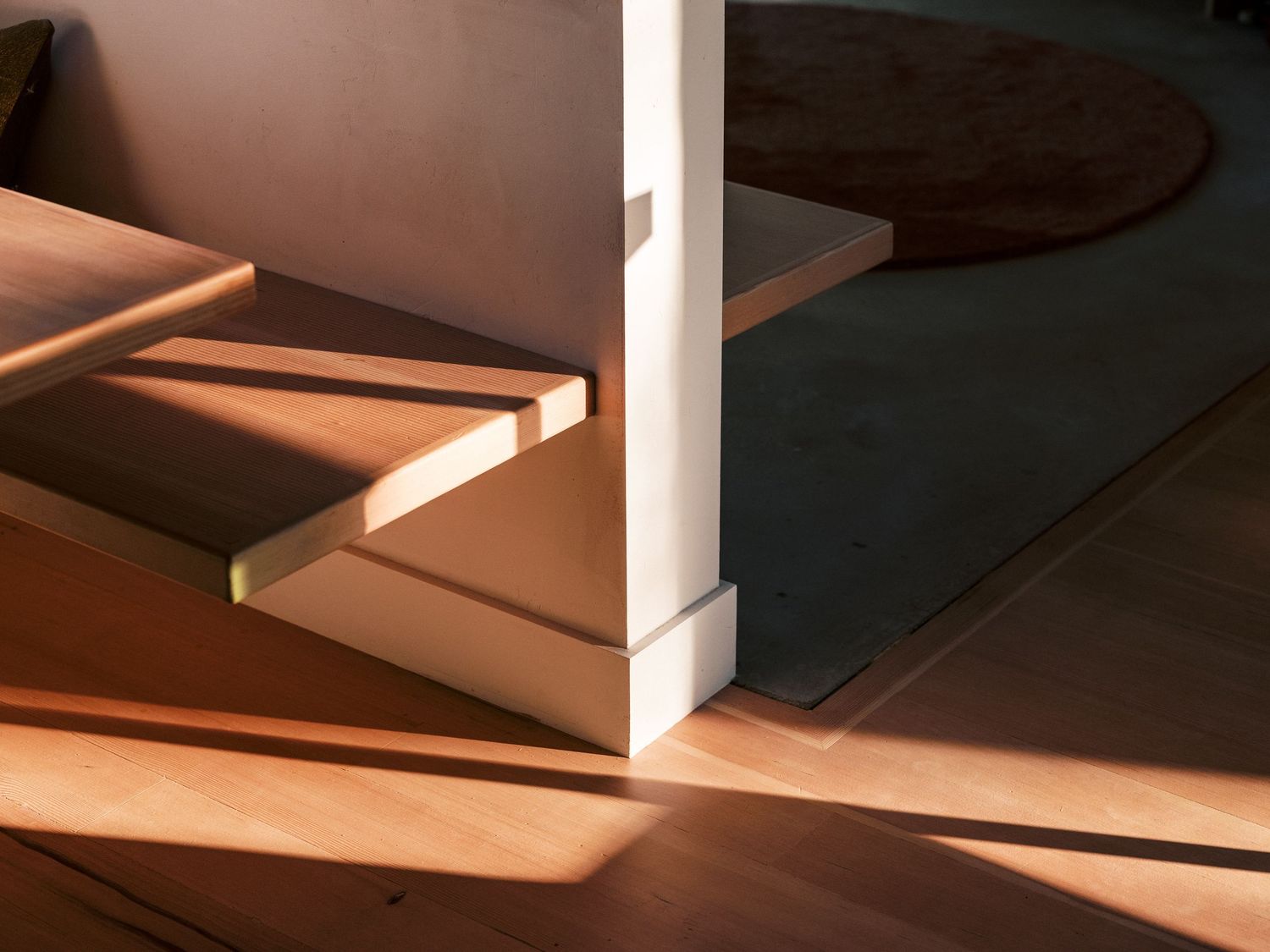 Architectural detail showing dramatic shadows cast by structural elements in natural light.