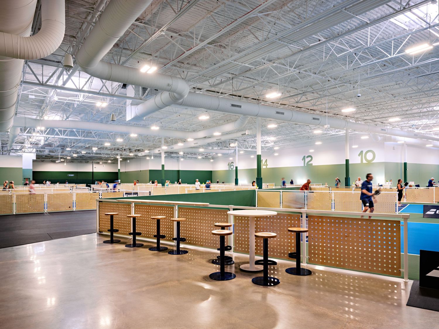 Large indoor recreational facility with high ceilings and modern design elements.