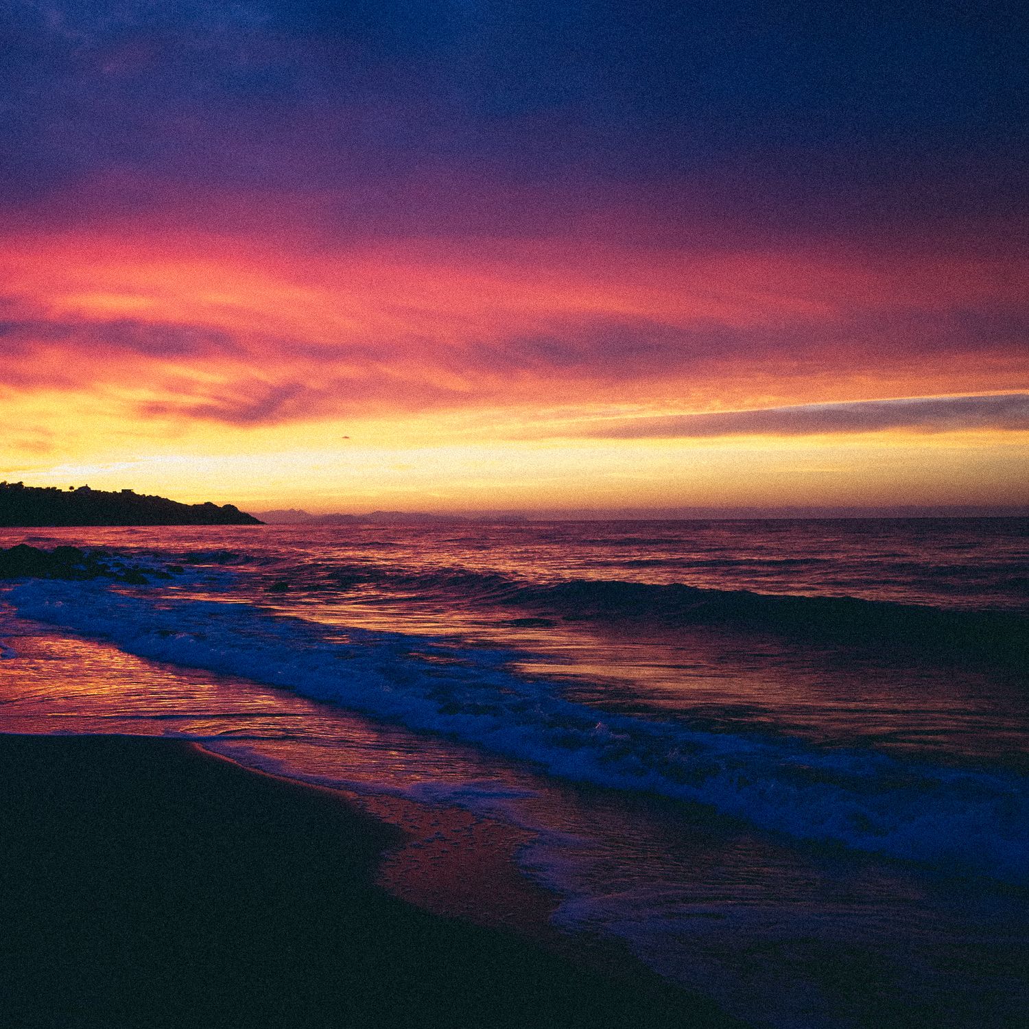 Panoramic sequence of a vibrant sunset over the ocean with pink and purple clouds reflecting on the water's surface.