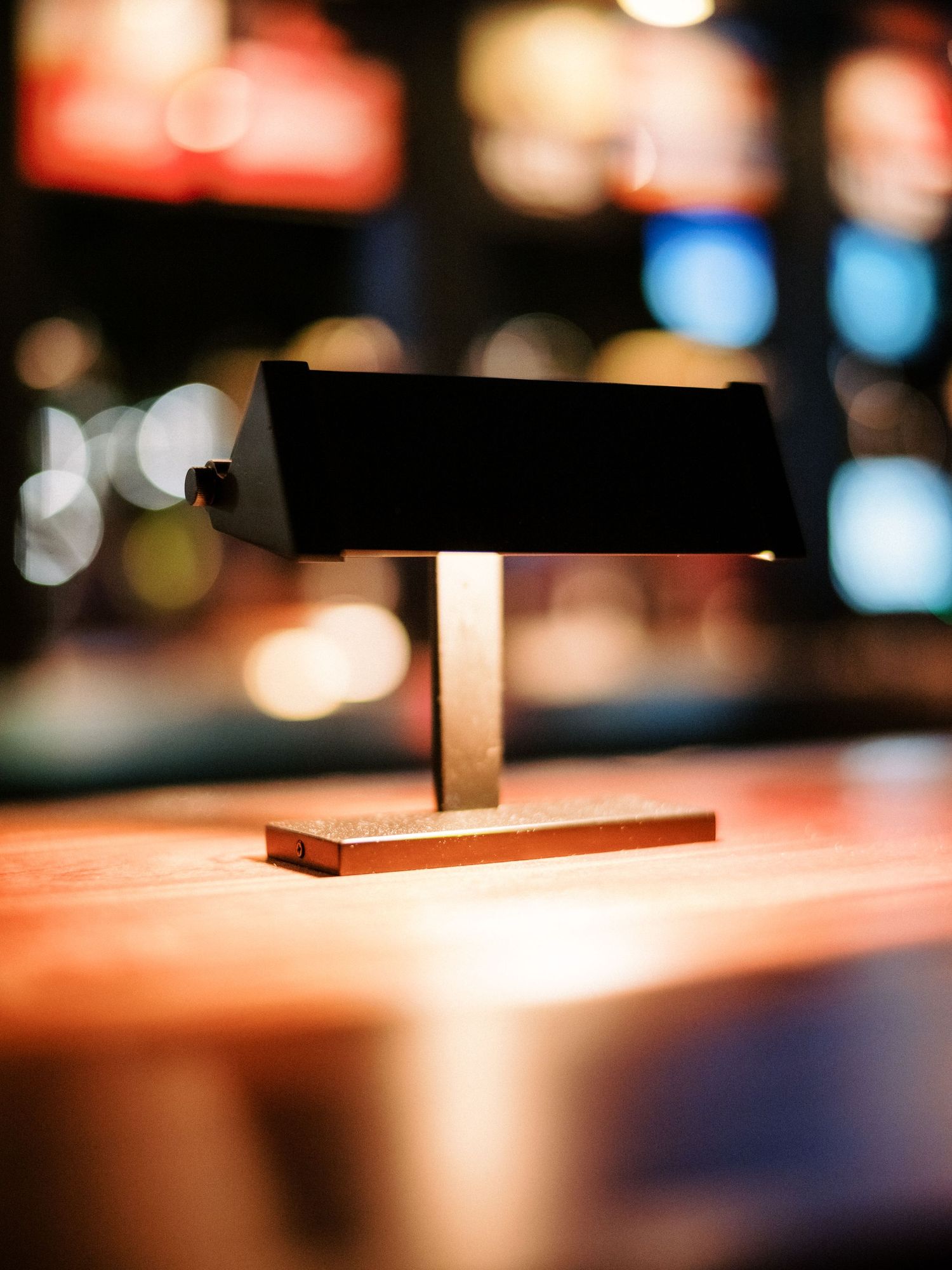 Artistic bokeh lighting effect with warm orange tones in dark ambient setting.