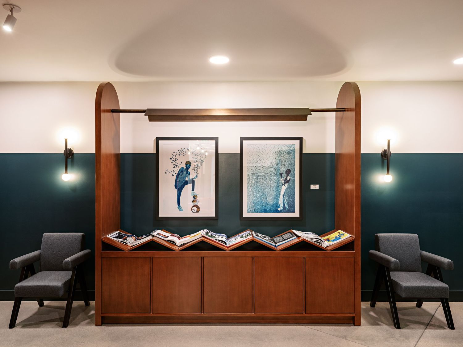 Minimalist hallway with wood paneling and modern seating arrangements.