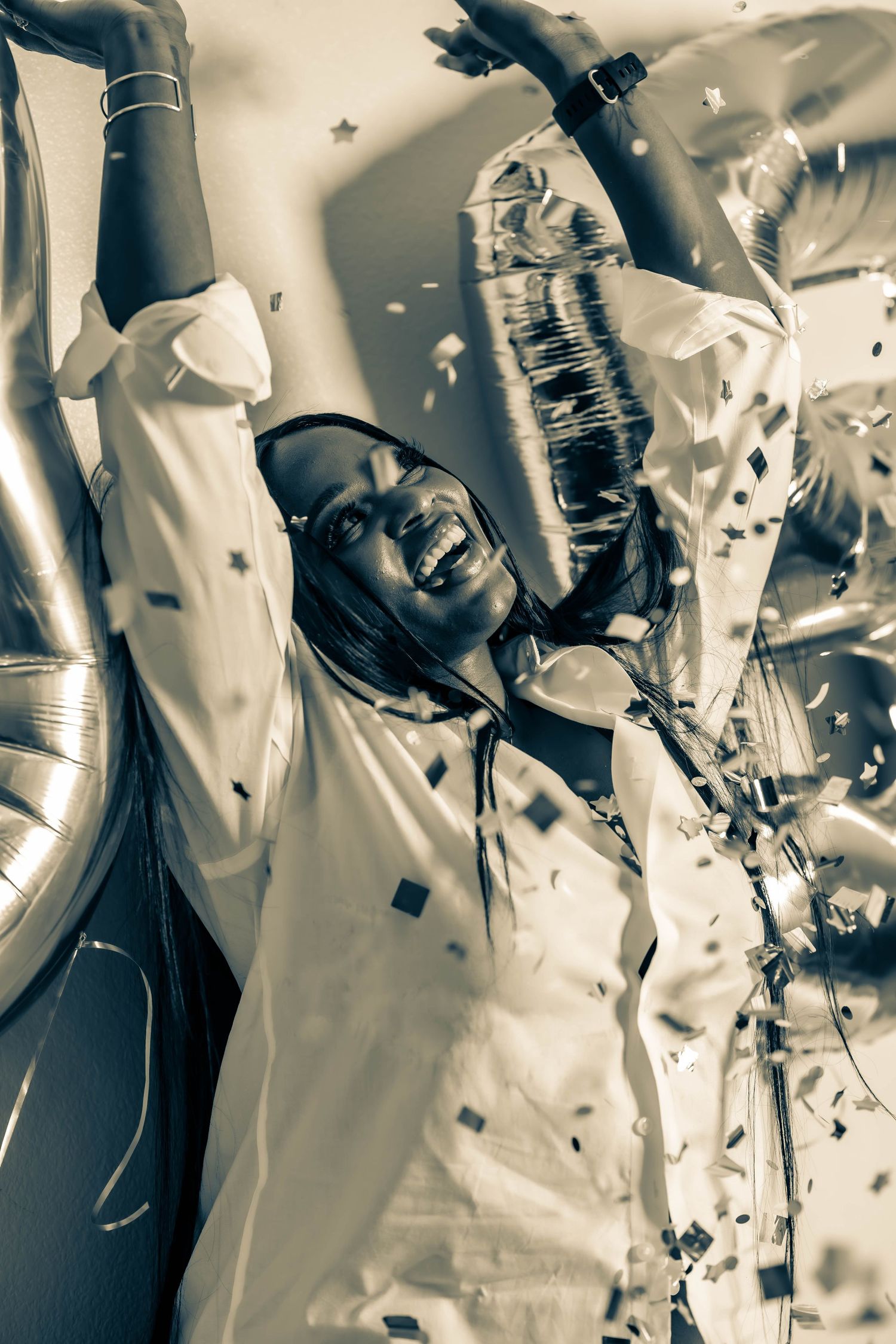 Black and white artistic photo sequence showing motion and flowing white fabric.