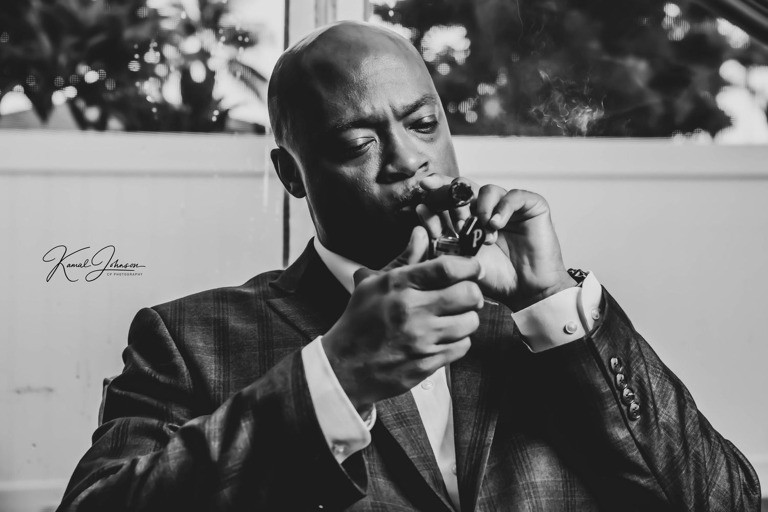 Monochrome images showing contemplative moments with cigar smoke in natural lighting.