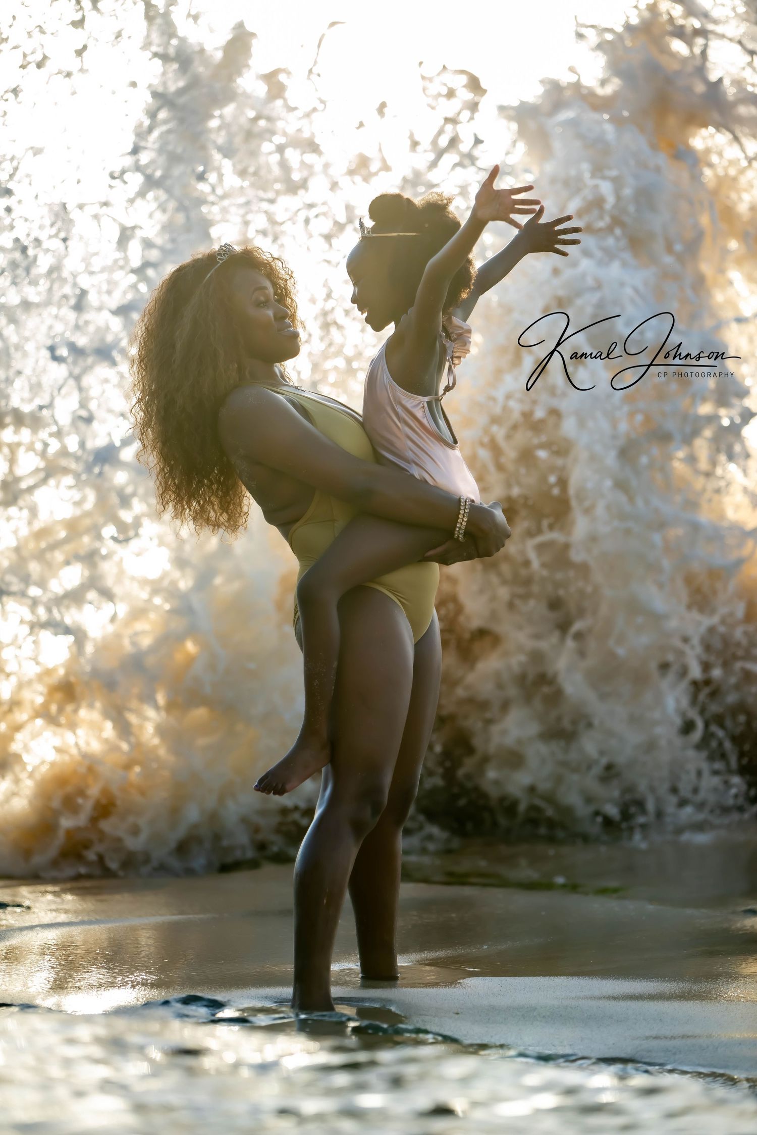 Romantic silhouettes of a couple dancing and embracing at sunset against a textured wall background.