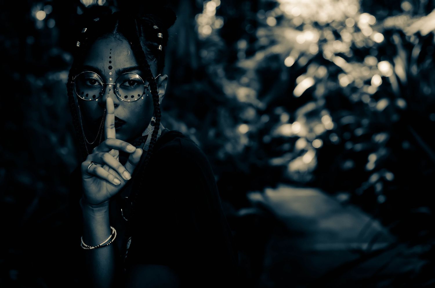Moody dark photography with silhouettes against deep blue tones.