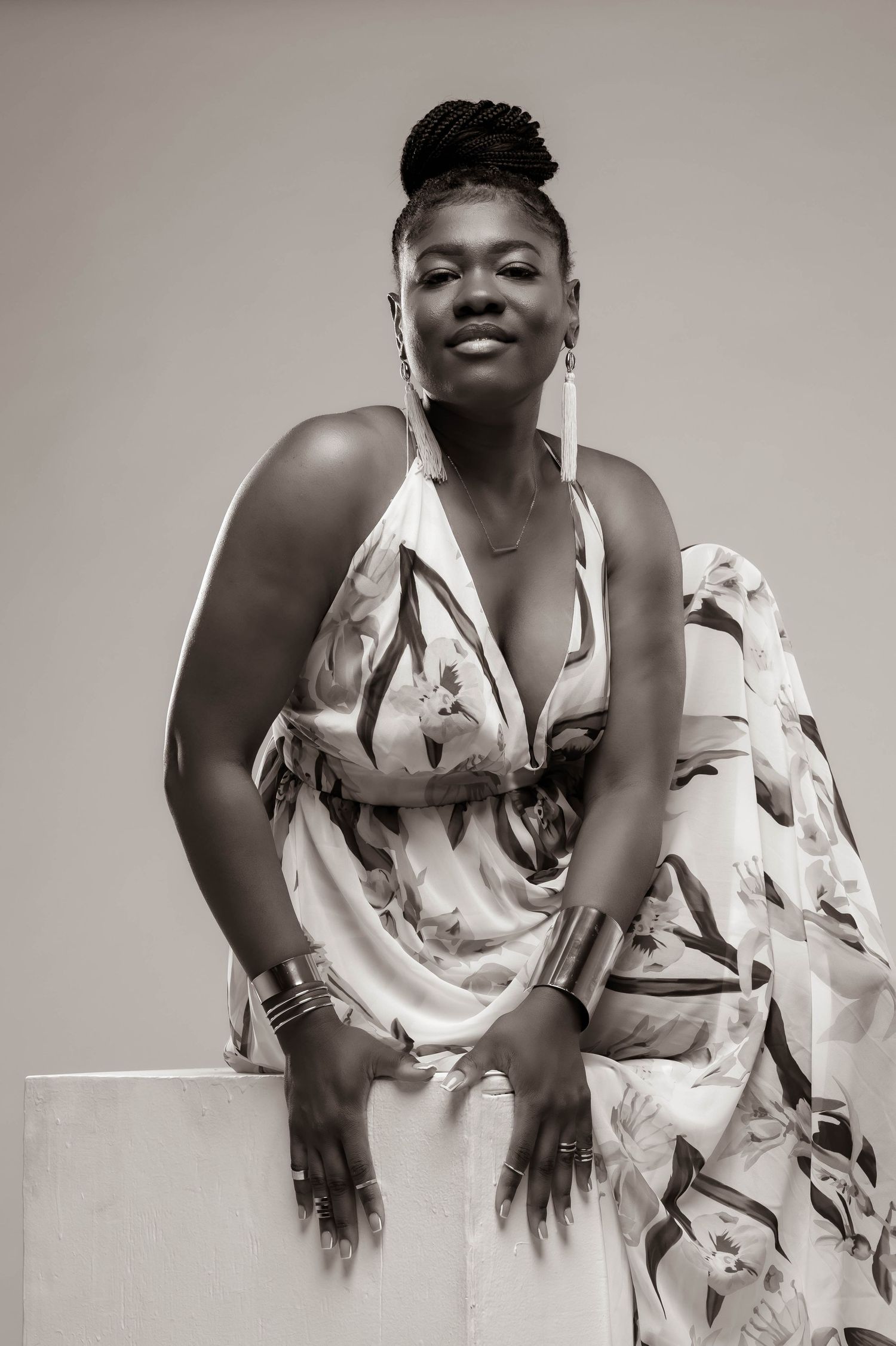 Sequence of expressive poses in a white floral dress against a light background.
