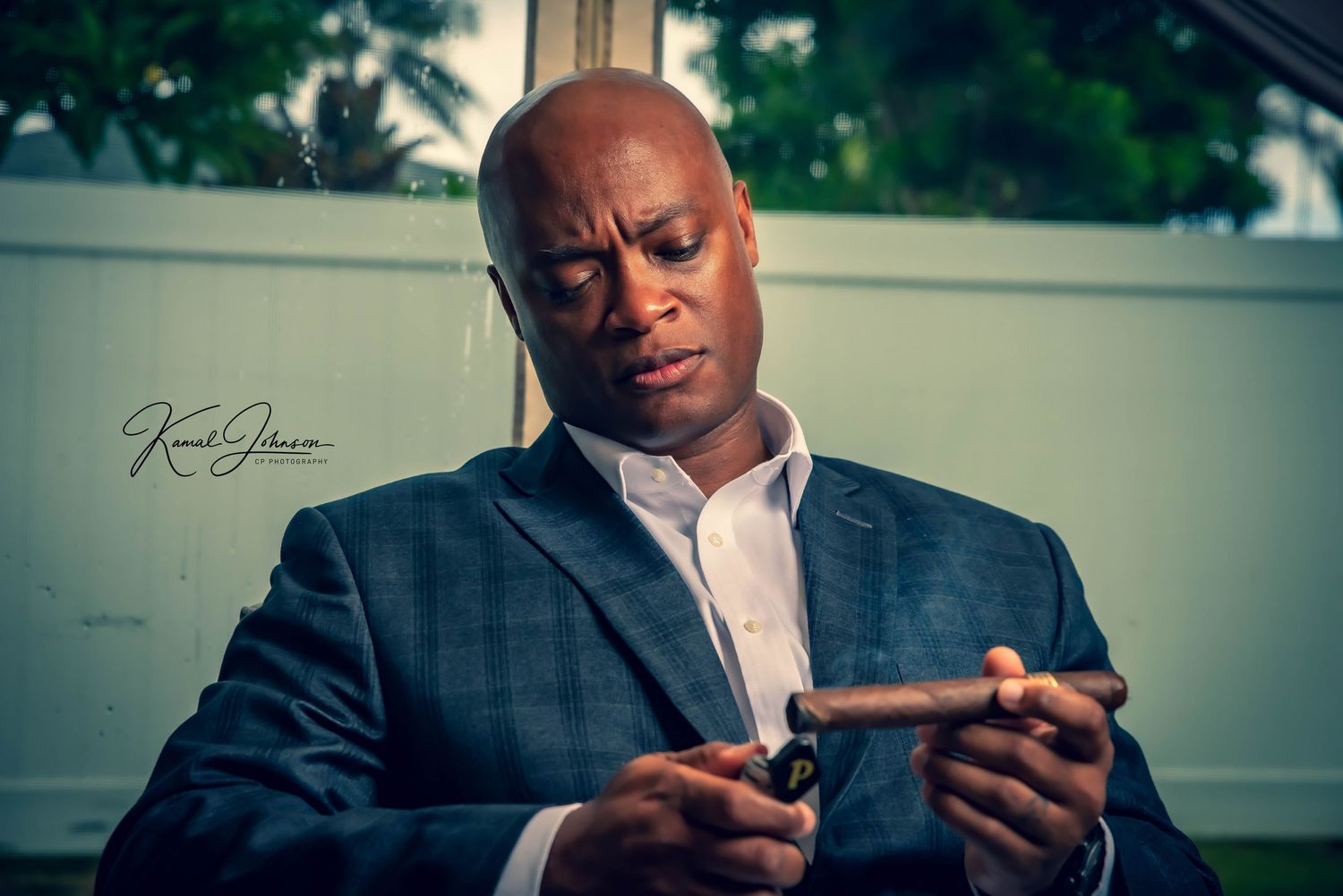 Professional man in business suit looking at mobile device.