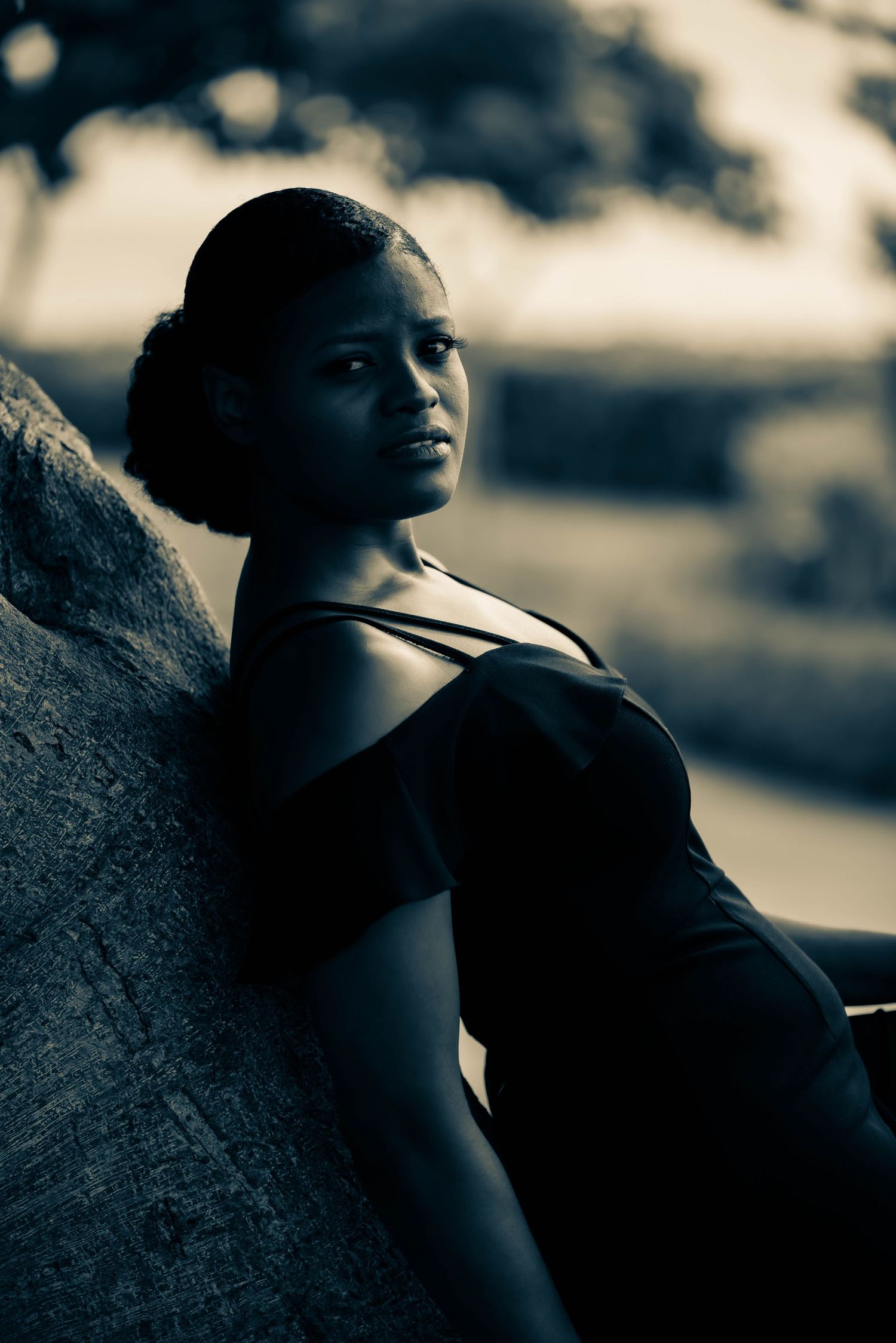 Artistic black and white portrait series capturing dramatic side profile poses.