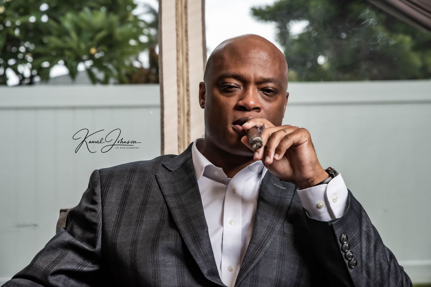 Elegant black and white photography capturing moments of reflection with cigar smoke.