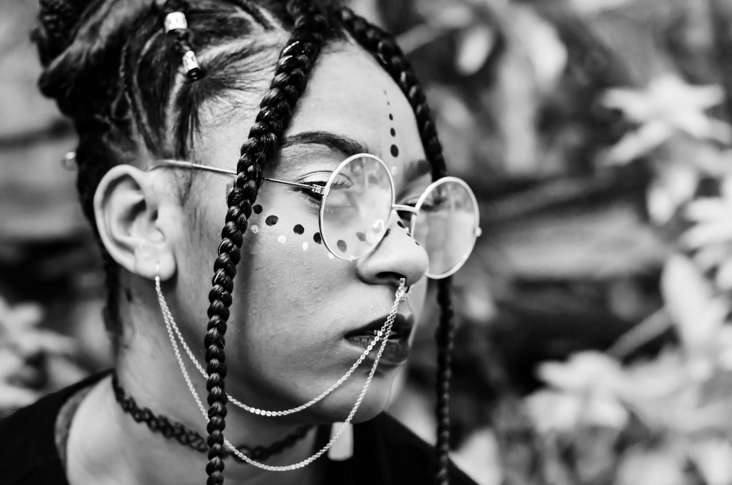 Close-up black and white portrait showing intricate details and textures.