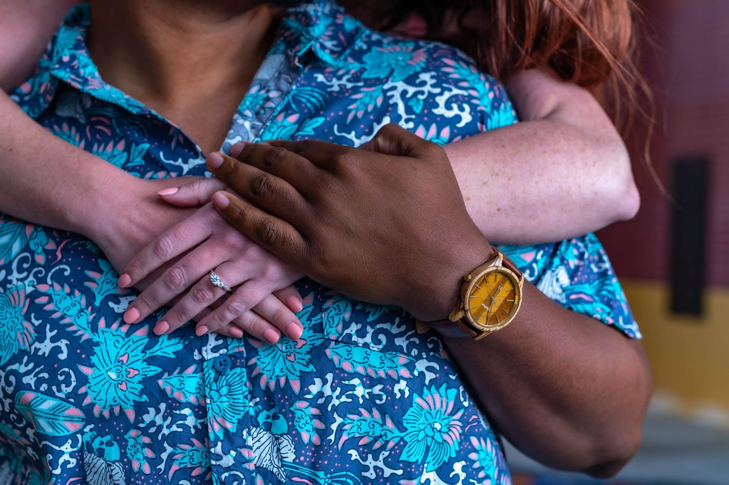 People wearing bright blue floral patterns shown in cropped detail shots.