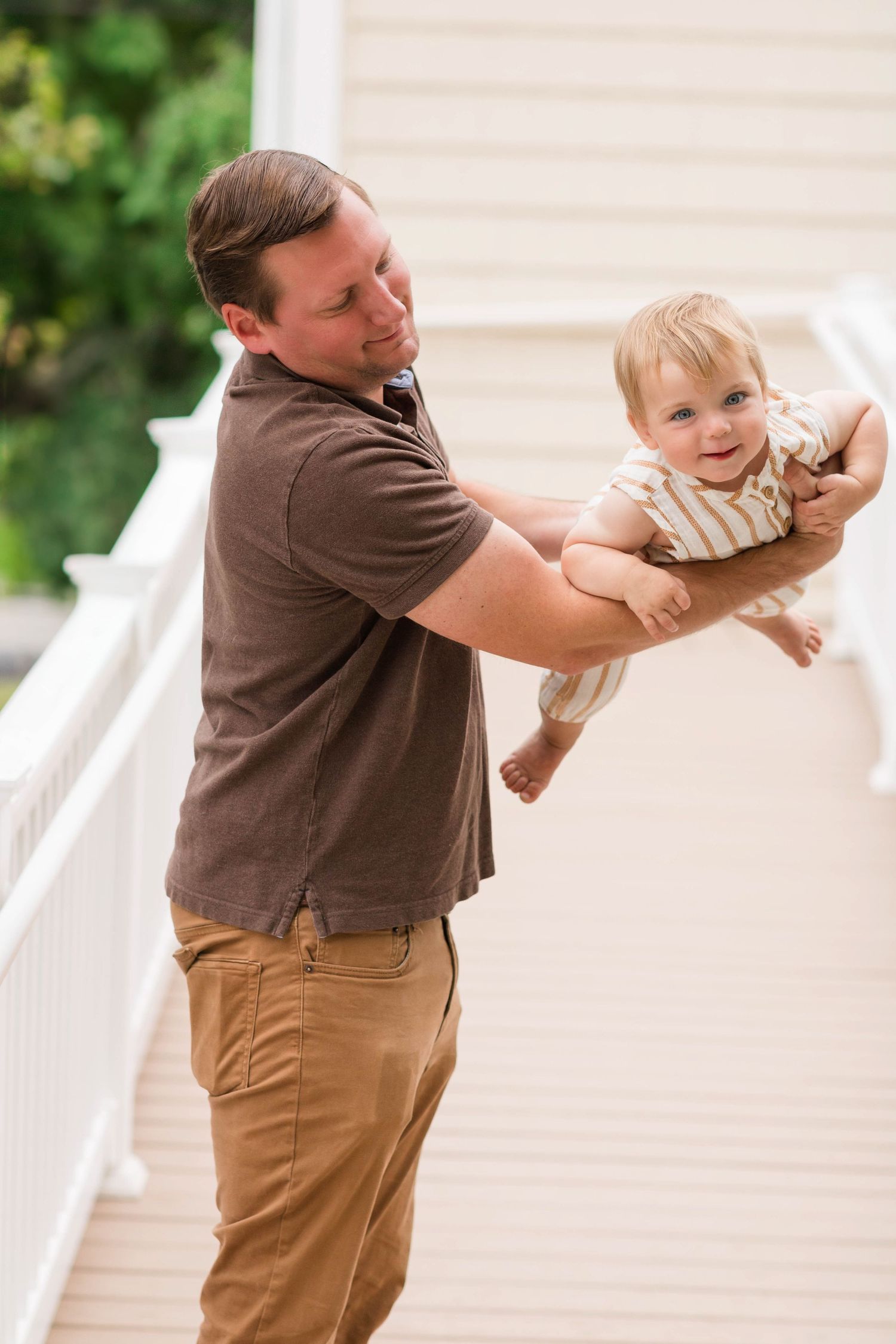 A sequence of photos shows a playful interaction between a person in brown shirt and khakis with a small cat on a porch.