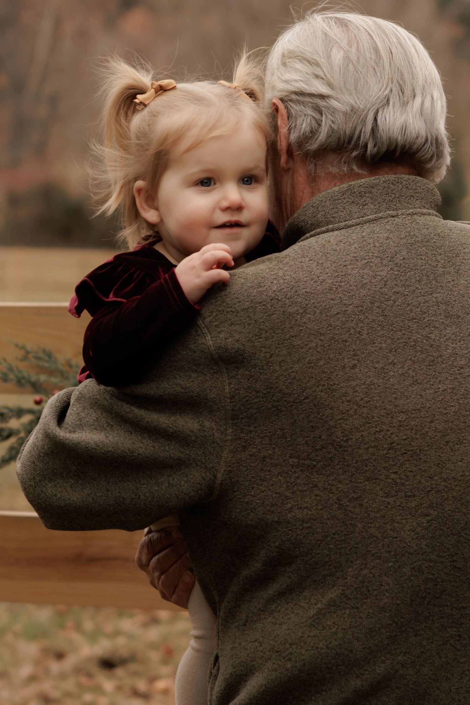 A tender moment captured between two people in warm autumn light.