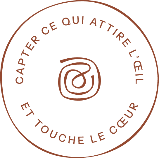 Reddish-brown circular text elements forming a repeating pattern.