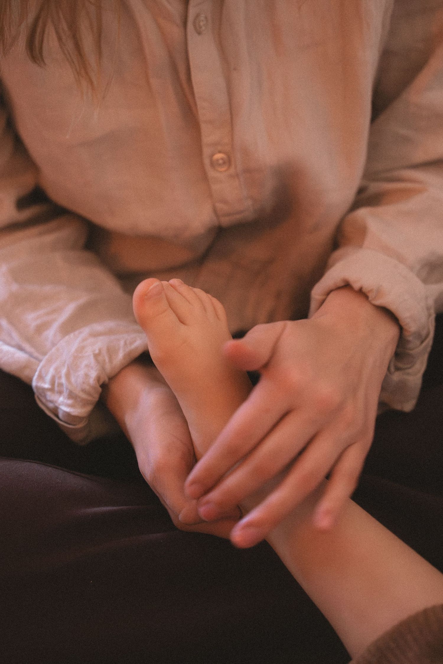 A series of close-up photos showing hands holding and touching in an intimate sequence.