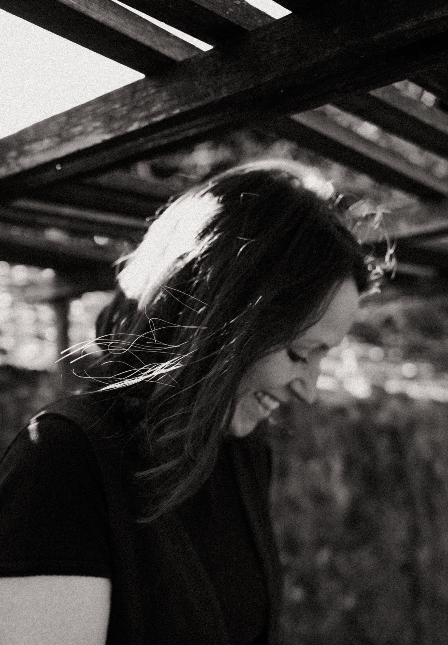 Dramatic black and white portrait sequence showing flowing hair in motion.