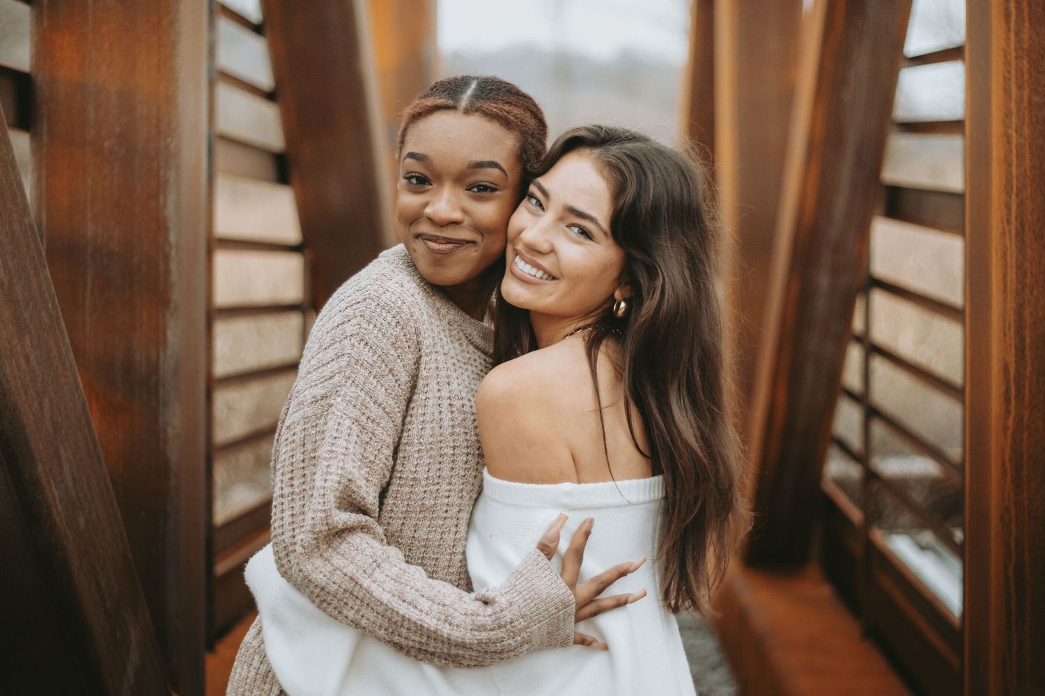 Best friends laughing during outdoor photoshoot in Bentonville Arkansas