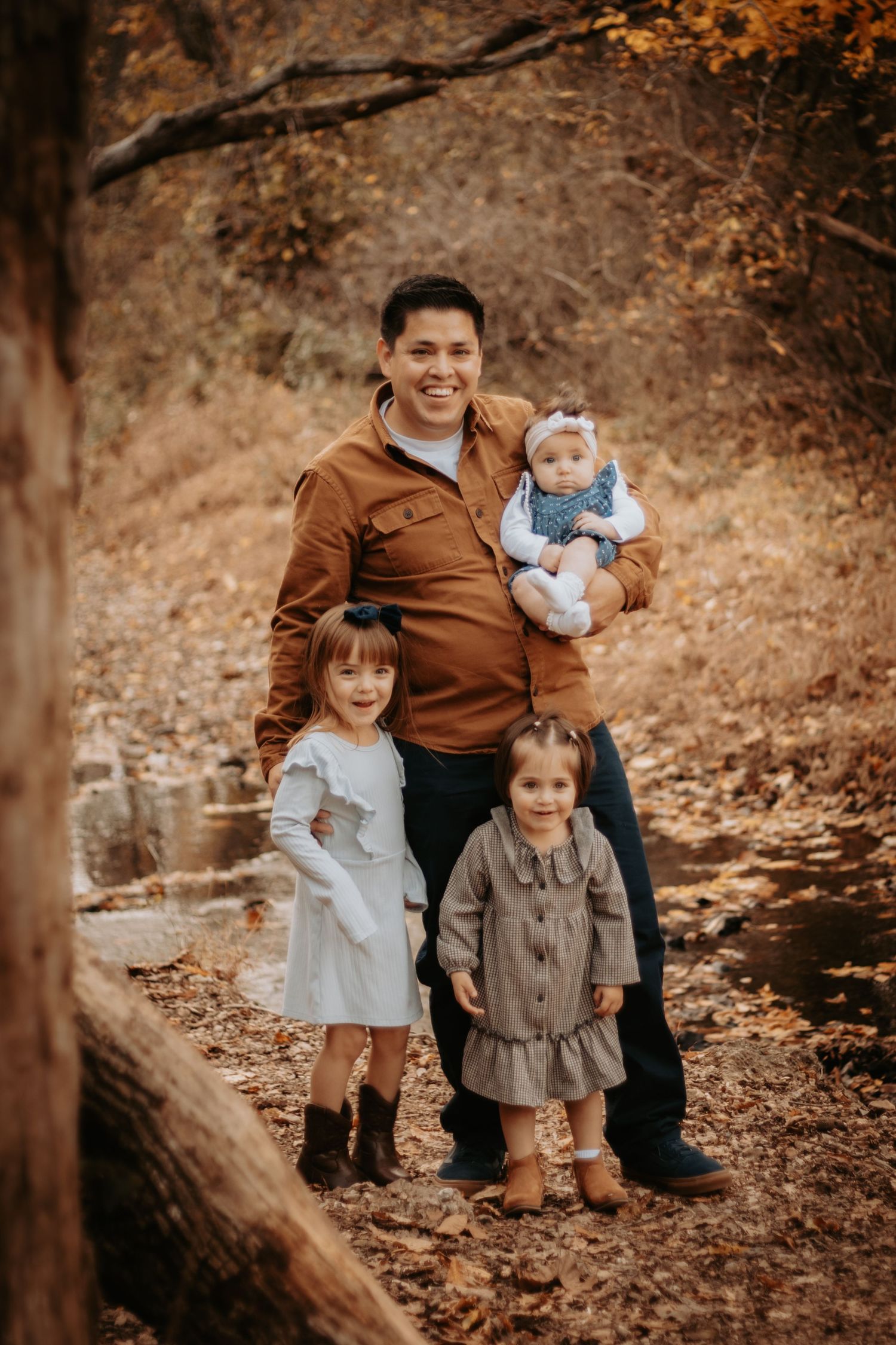 Candid family standing pose during relaxed photoshoot in Northwest Arkansas
