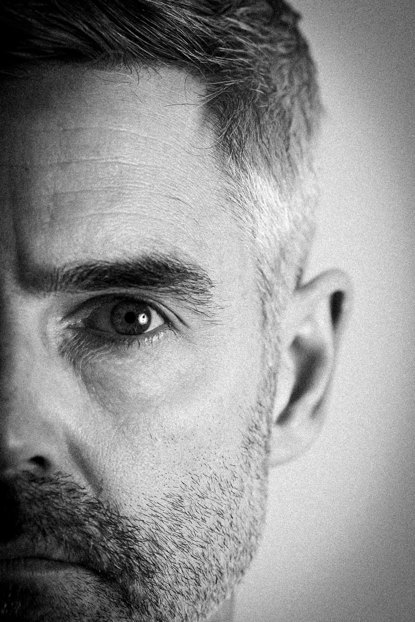 Dramatic black and white portrait series with moody lighting effects.