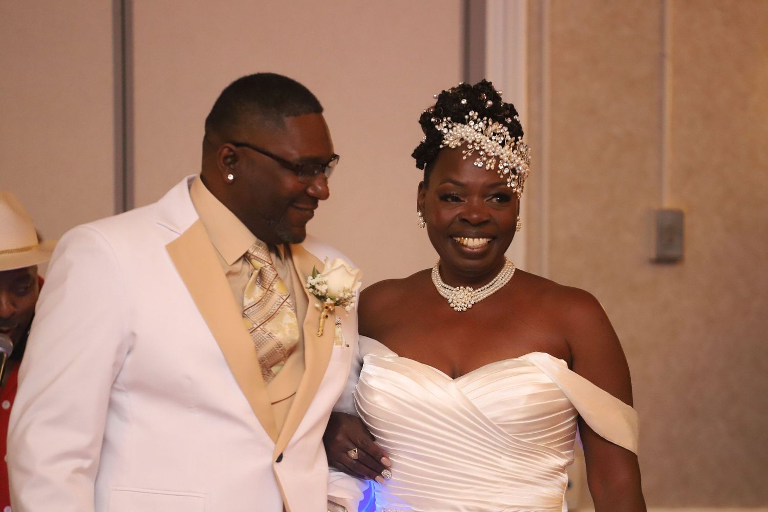 A couple shares their first dance at an elegant wedding reception.
