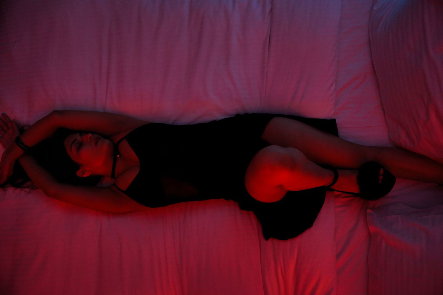 Artistic silhouette photography series with red lighting effects.