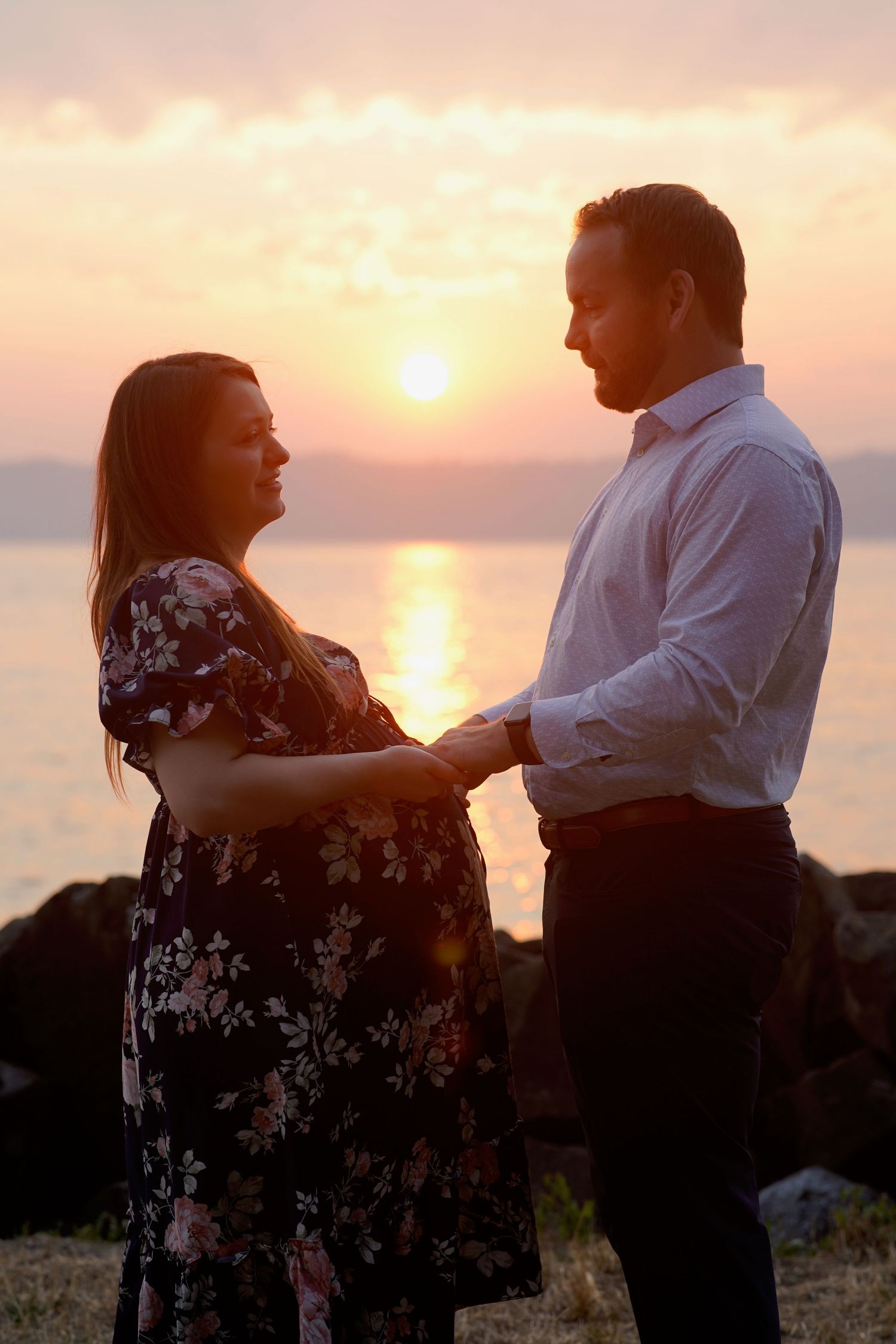 Wedding couple and family group gathered for a formal photo during an intimate wedding in Port Townsend, Washington
