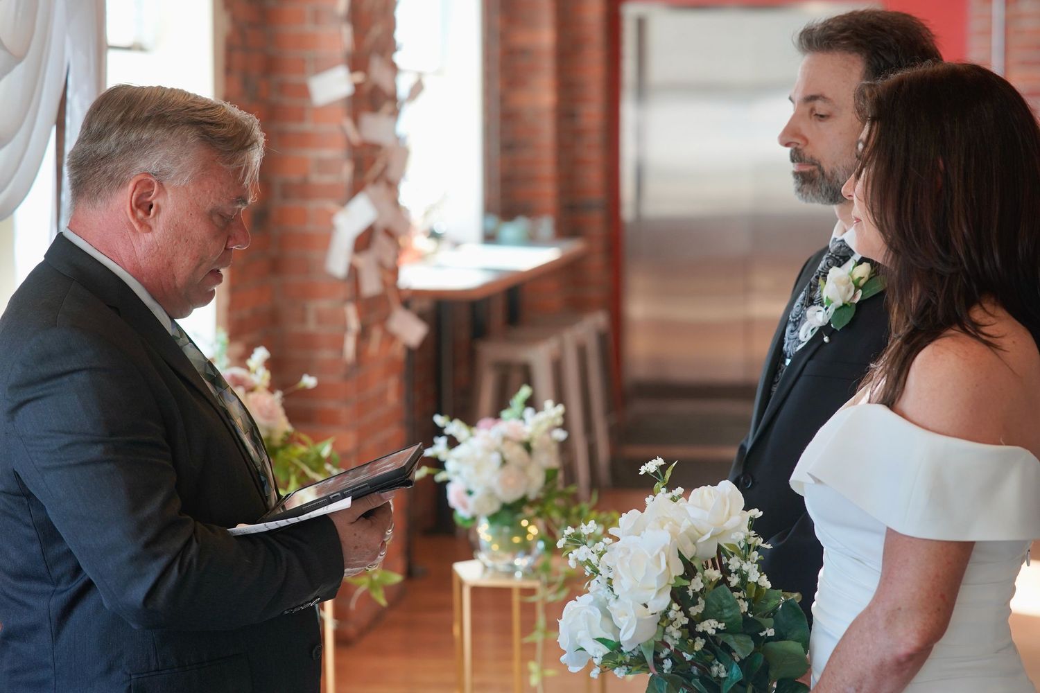 Bride and groom sharing a moment during an intimate wedding ceremony in Port Townsend, Washington