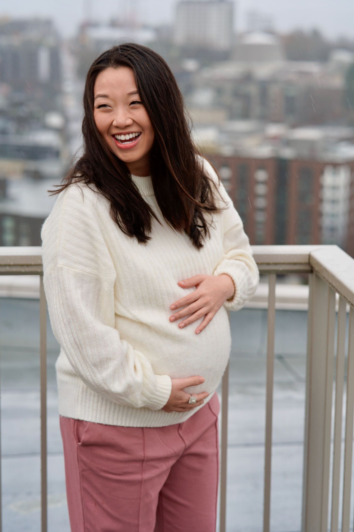 Expectant couple embracing during a natural-light maternity photography session in Port Townsend, Washington